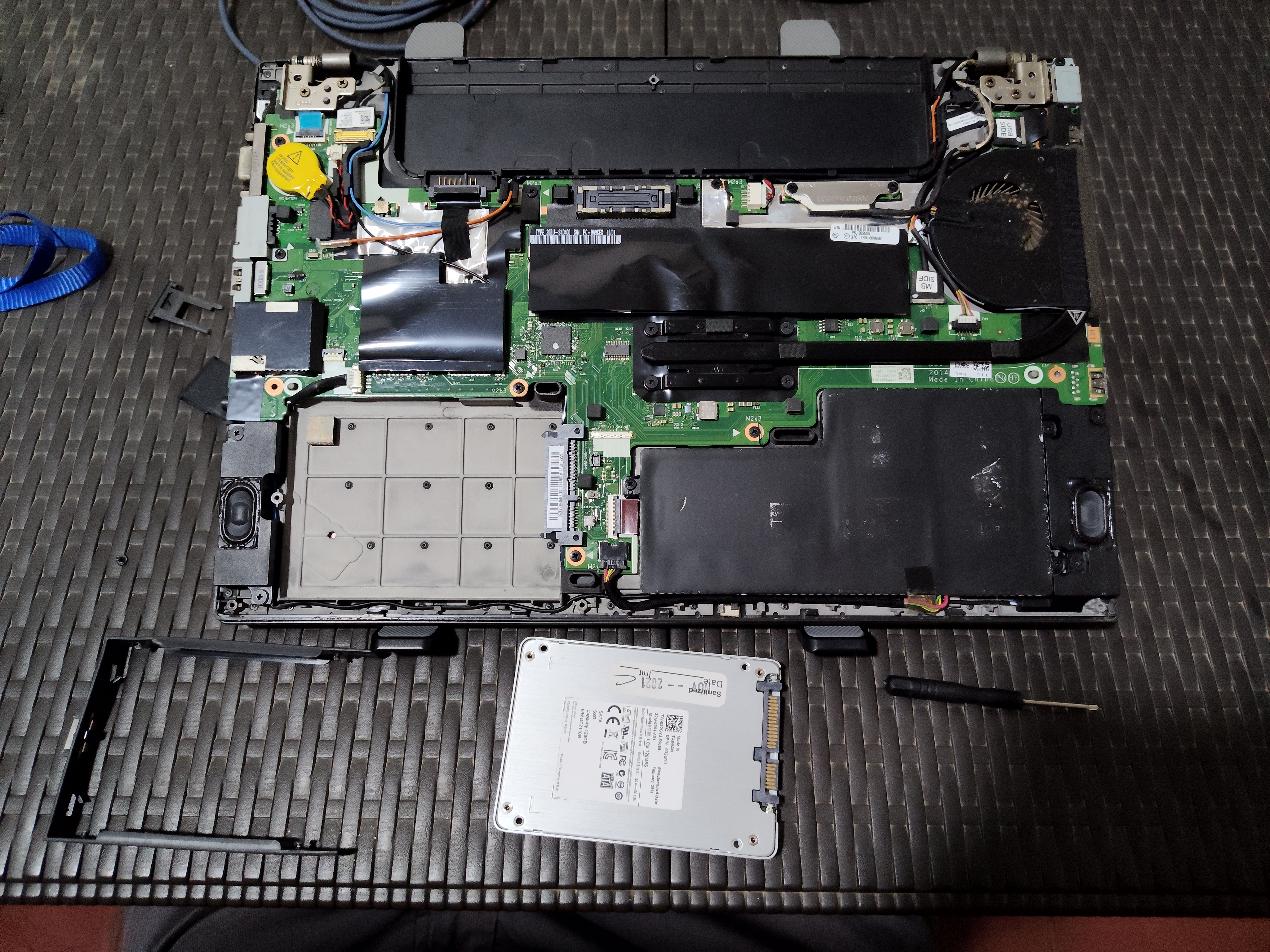Removed the old SSD with its enclosure from the laptop